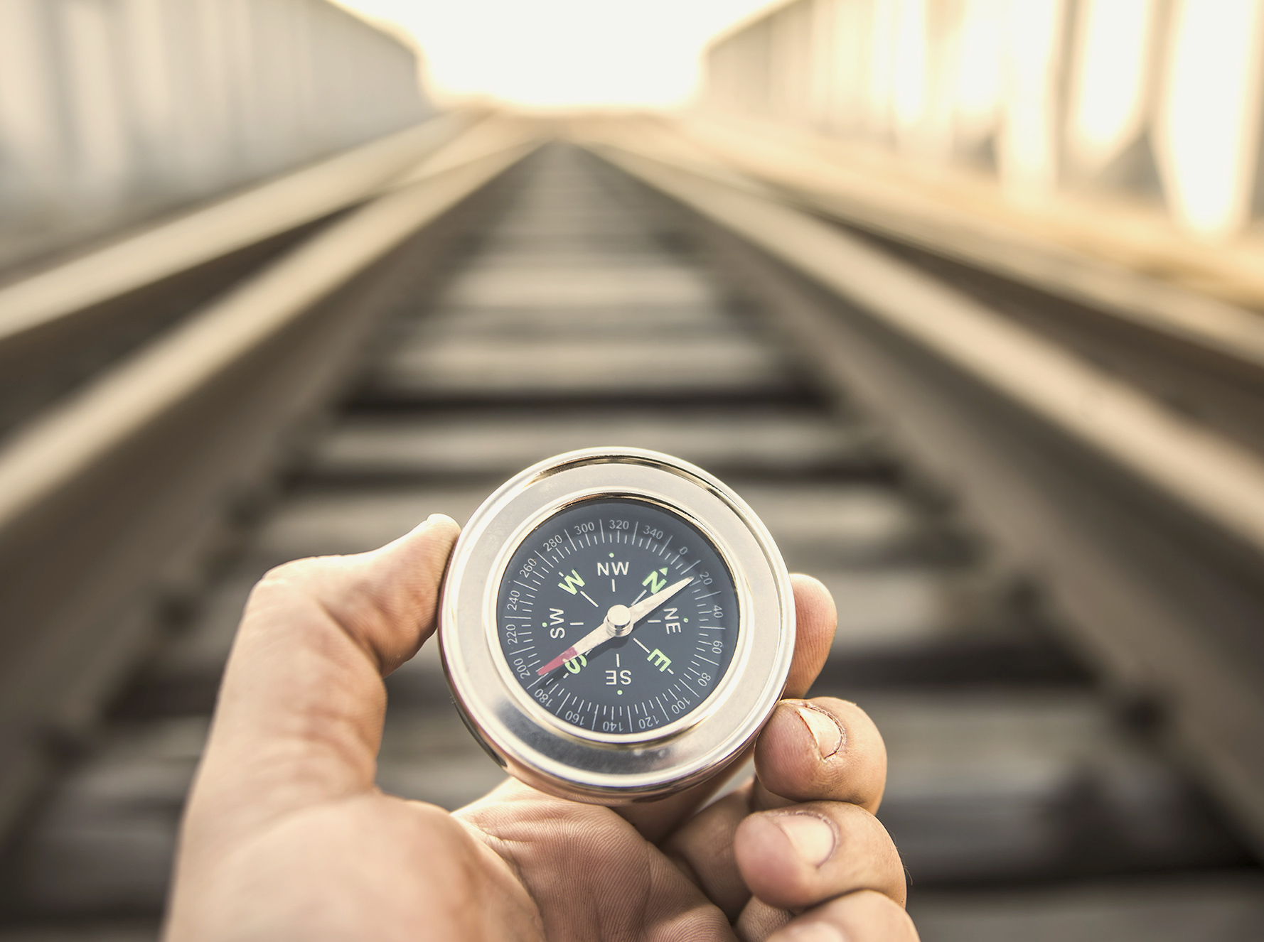 hand holding compass