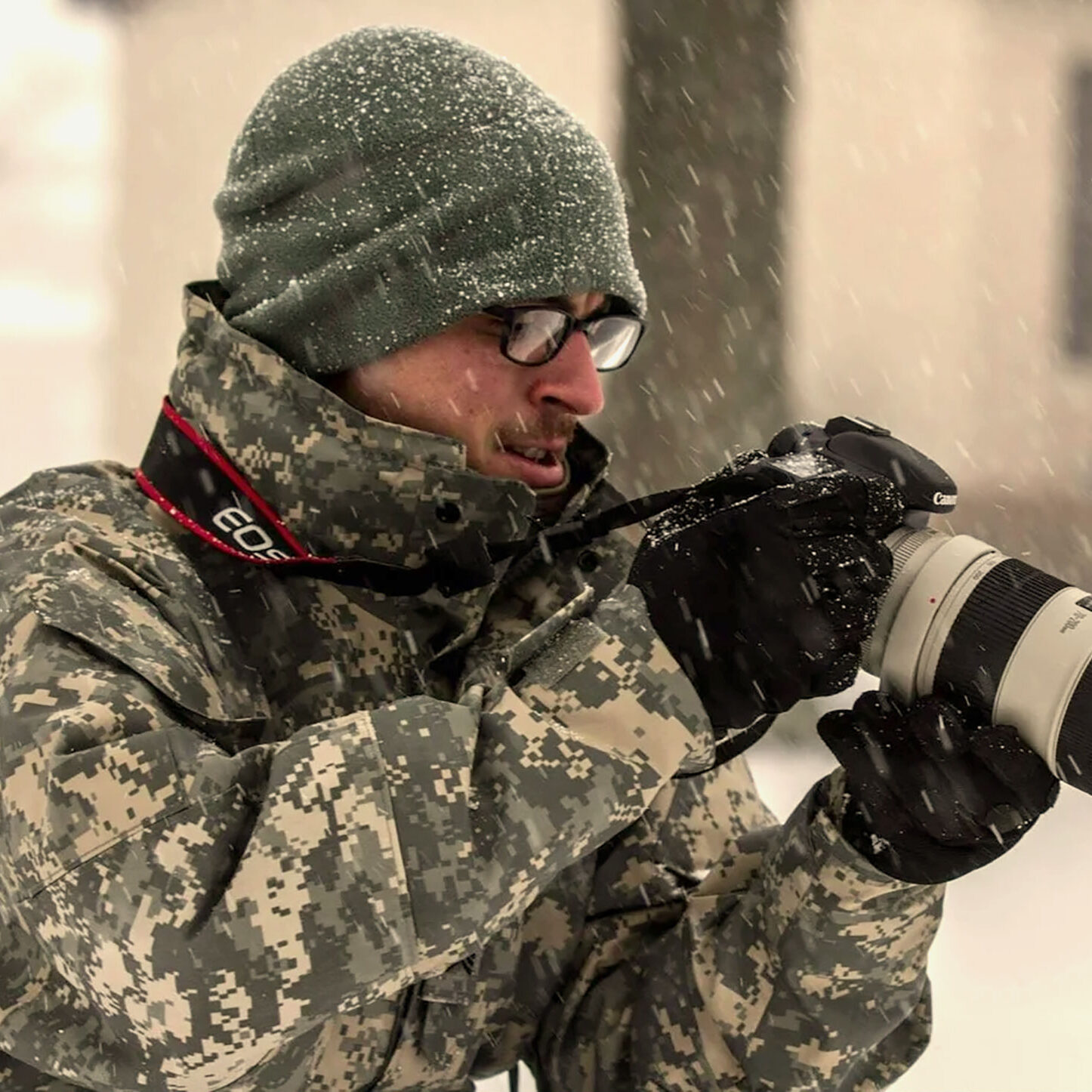 Kenneth Tucceri photographing in the snow.