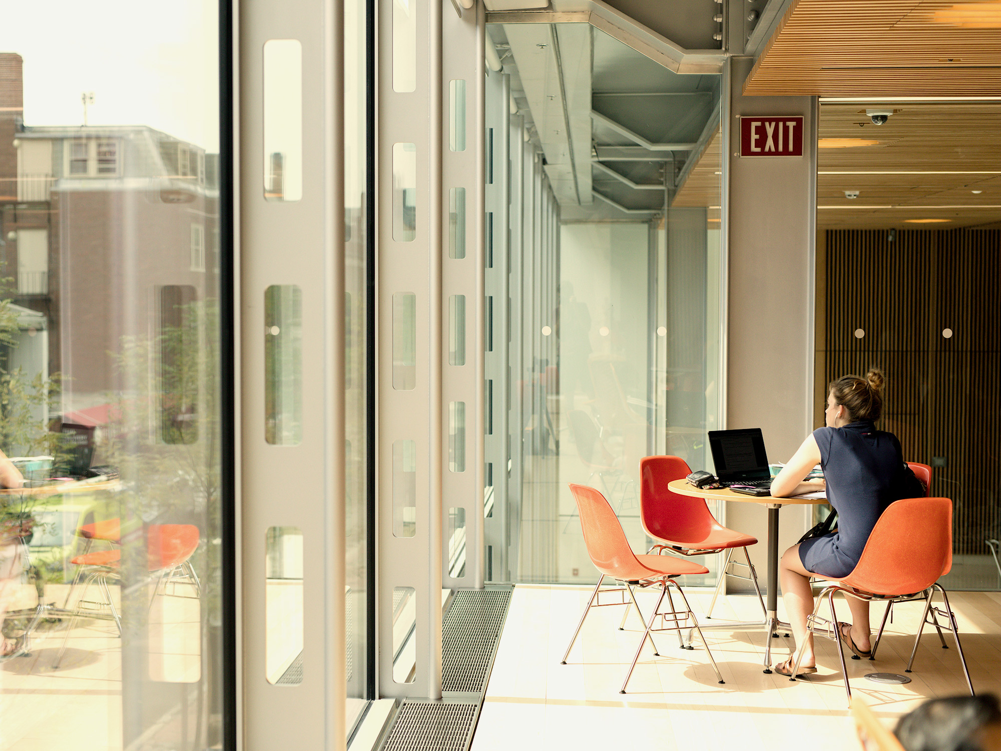 student sitting at table in Smith Center