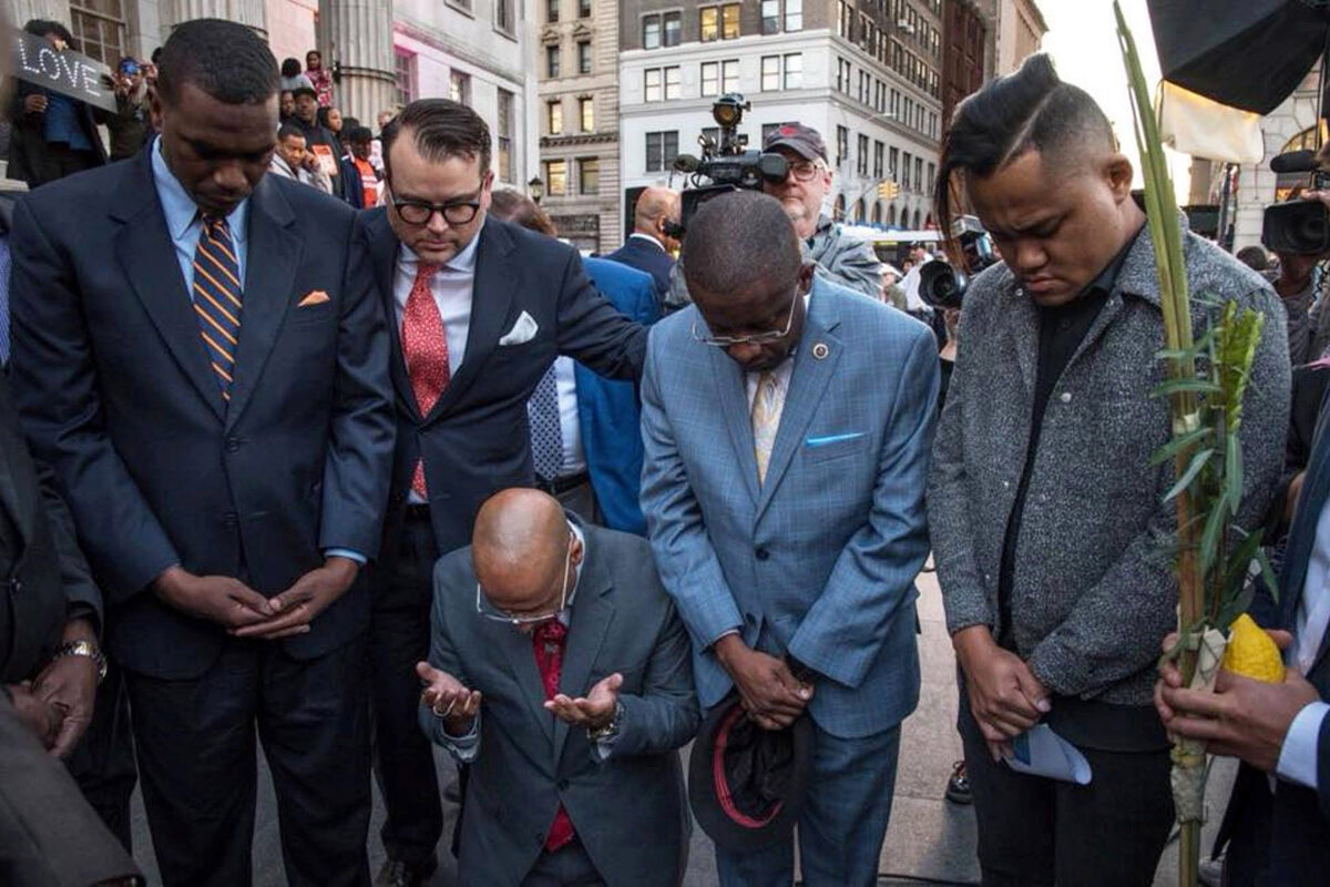 Evan Bernstein, New York regional director of the Anti-Defamation League and a Harvard Extension School graduate, participates in an interfaith prayer vigil outside Brooklyn Borough Hall.
