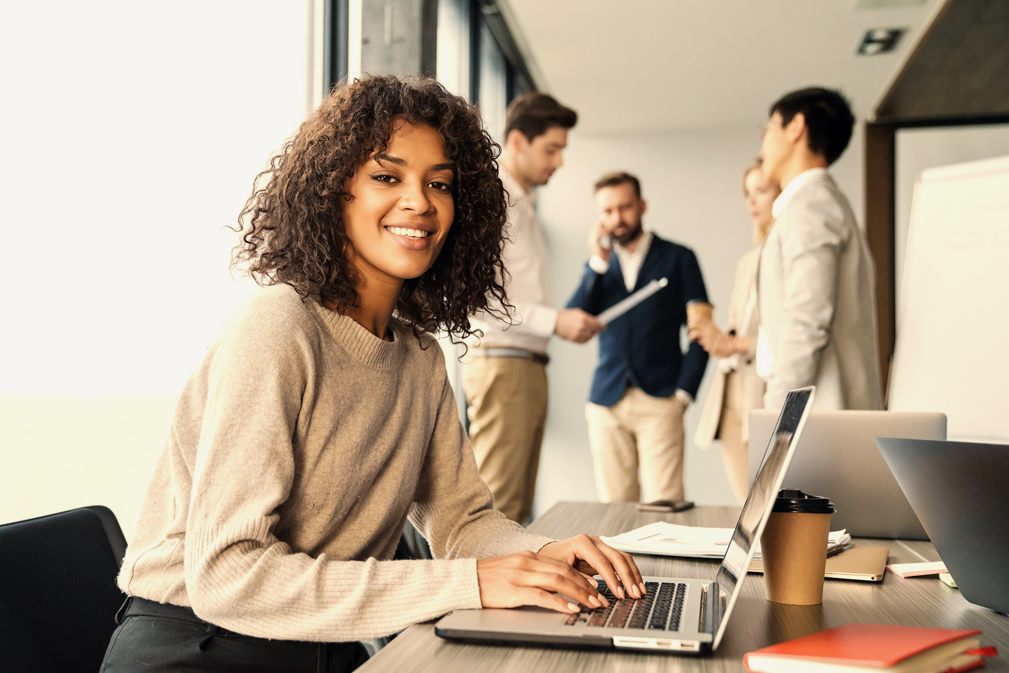 woman on laptop in conference room