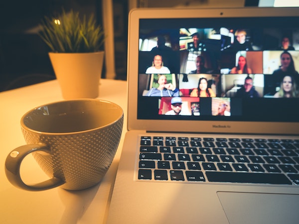laptop showing video meeting