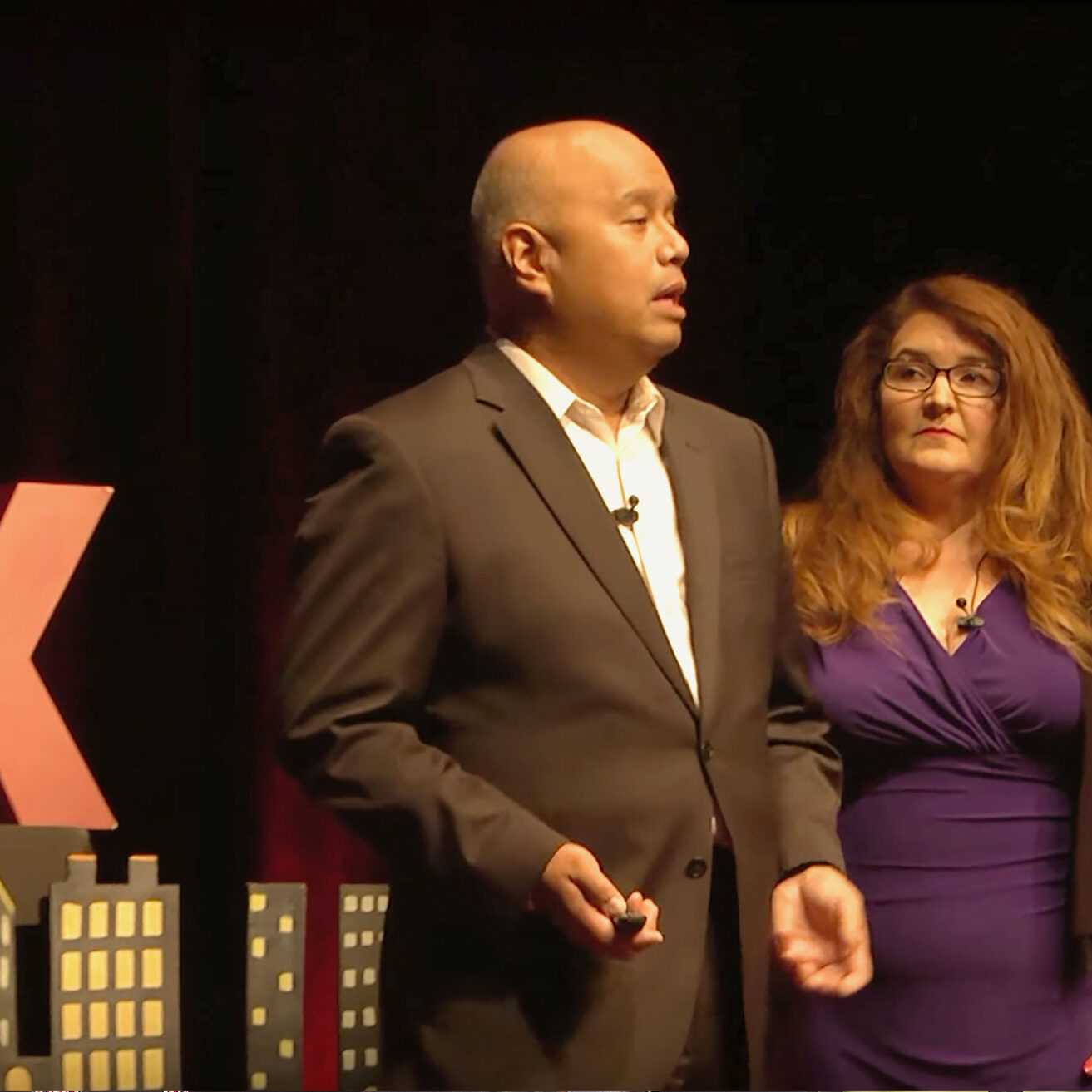 Daniel Farber Huang gives a Tedx talk with his wife, Theresa Menders.