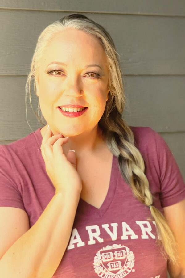 Laurie Dove poses in a Harvard t-shirt.