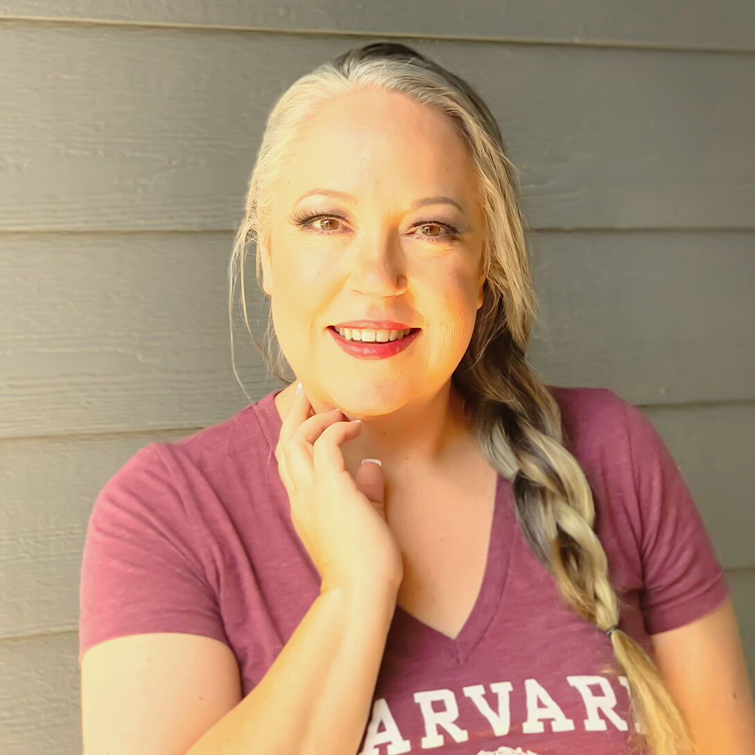 Laurie Dove poses in a Harvard t-shirt.
