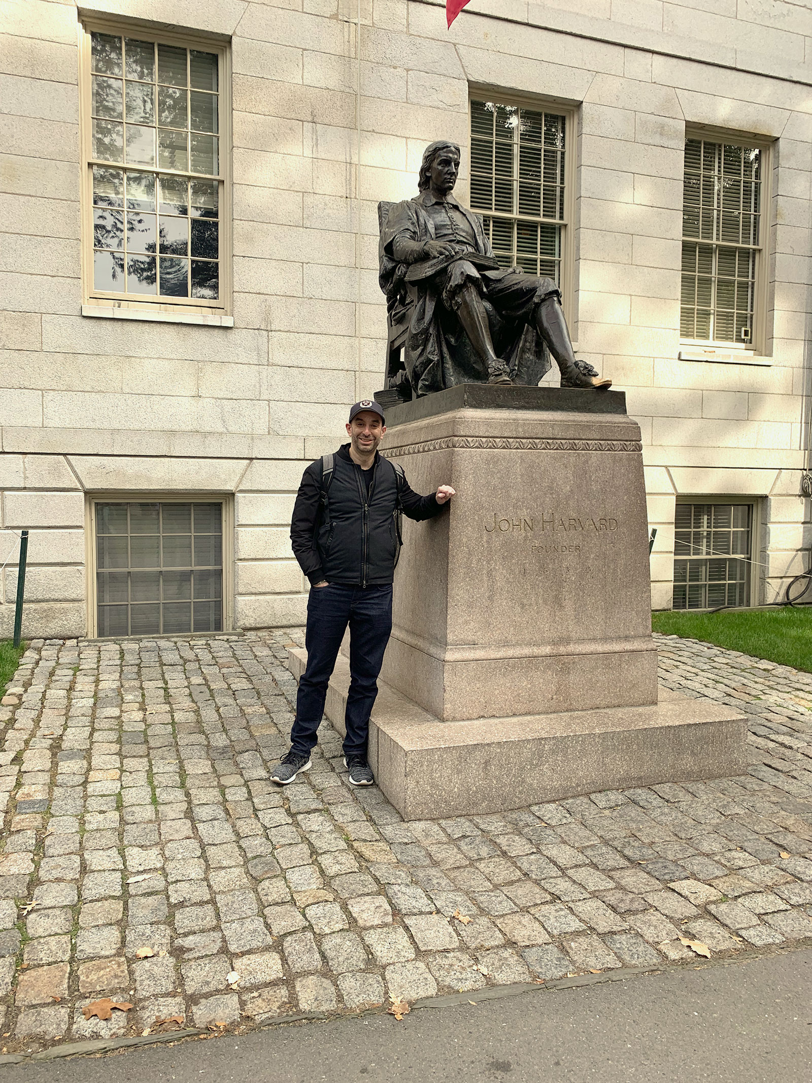 Frank Vounasis with John Harvard statue.