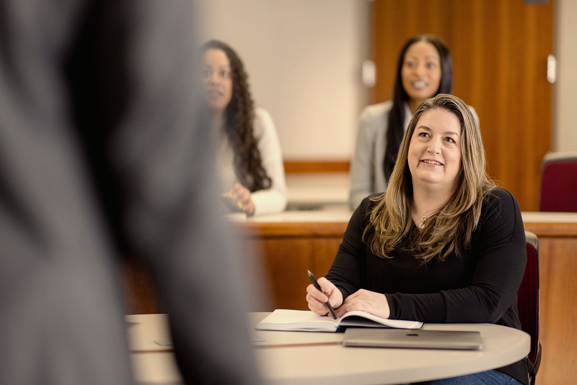 Harvard Extension School student sitting in a class.