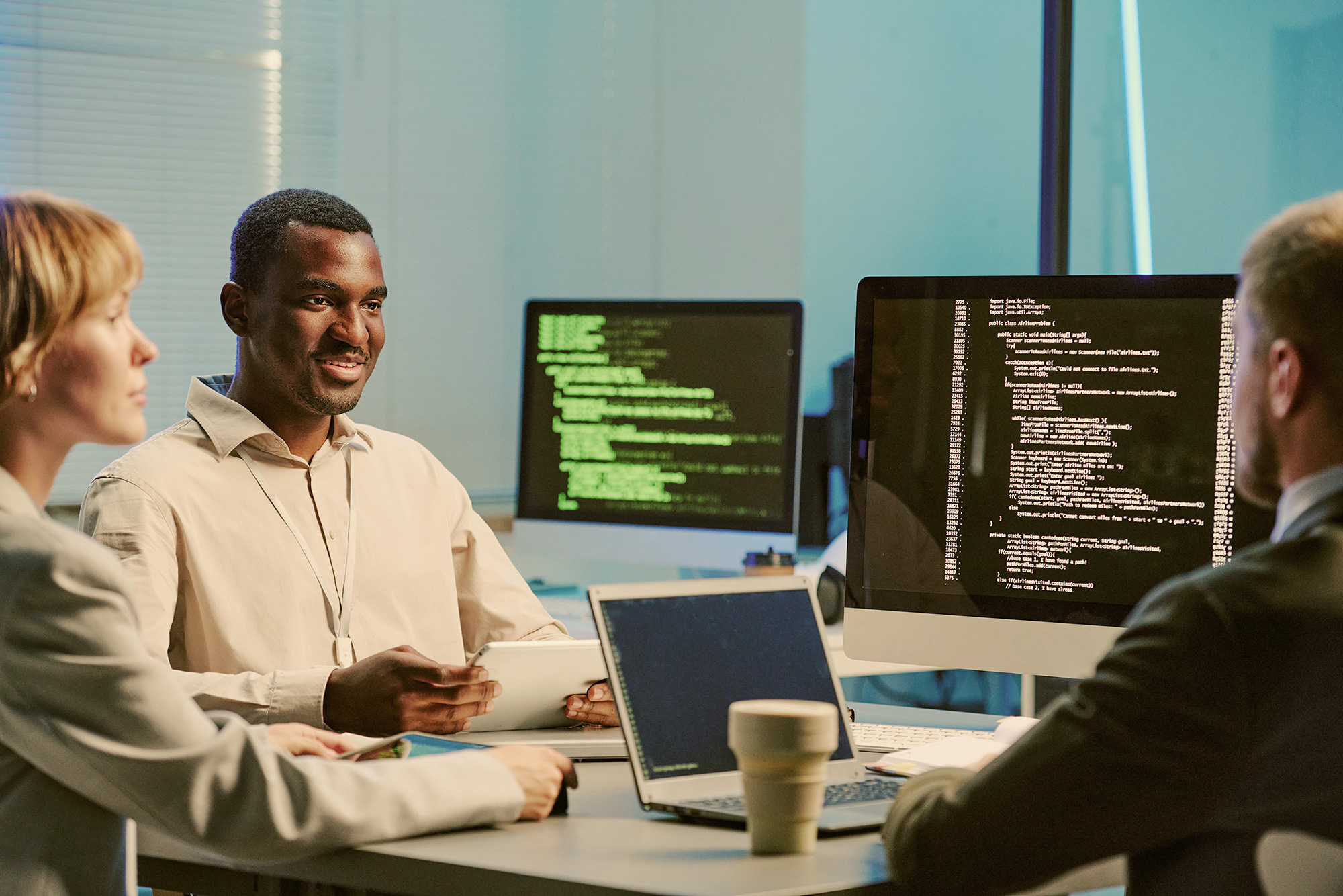 People speaking in a meeting.