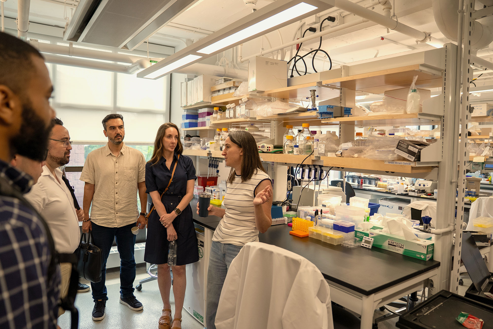 A group of Harvard Extension School students in the Harvard bio lab.