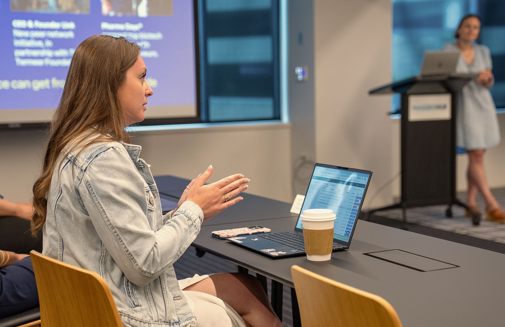 A Harvard Extension Student speaks during a lecture.