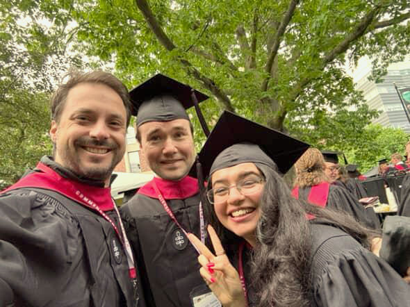 Basant poses for a selfie at Commencement with classmates.