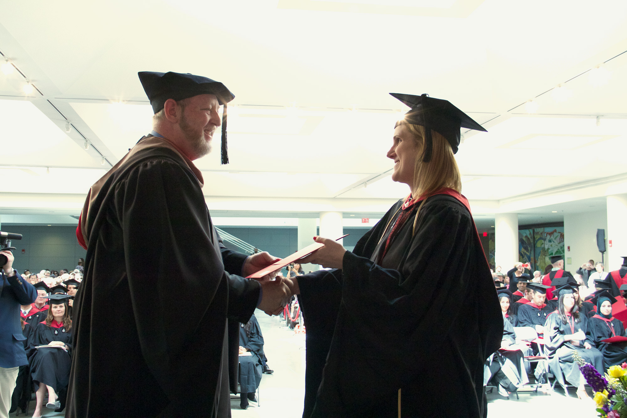 Shaking hands at Commencement.