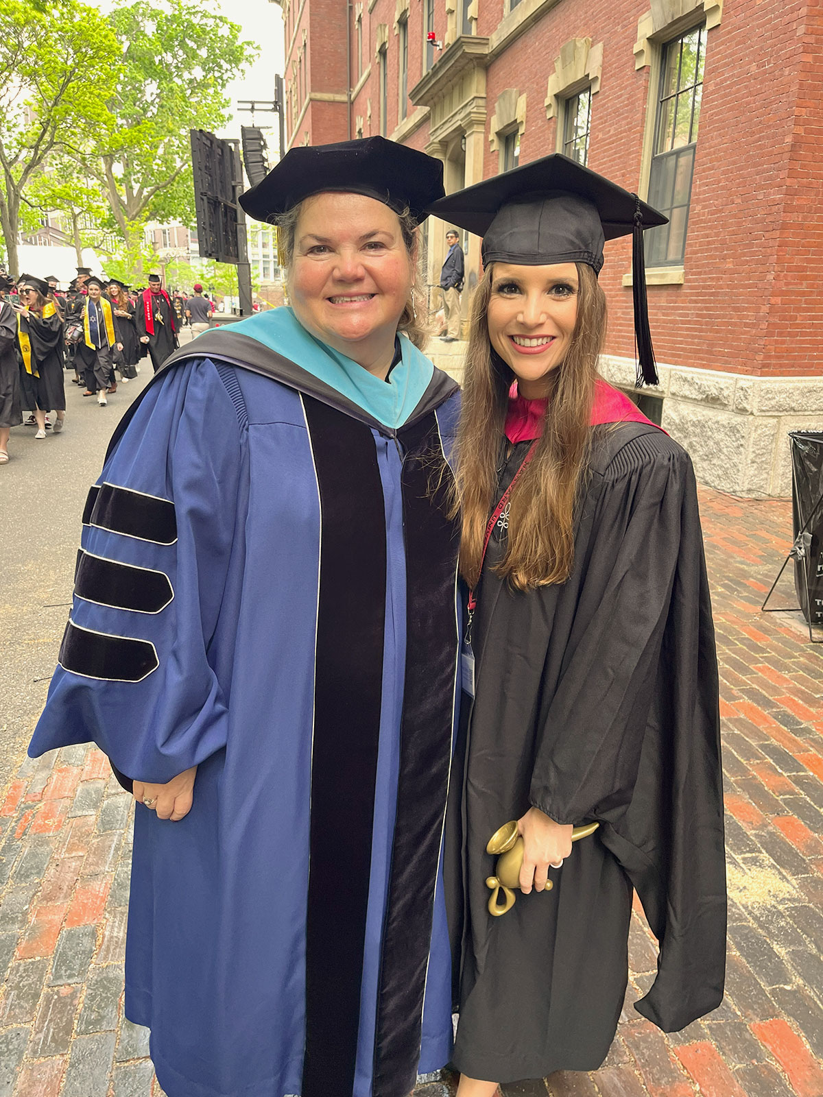 Harvard Extension School graduate, Christina Veta, with Dean Nancy Coleman