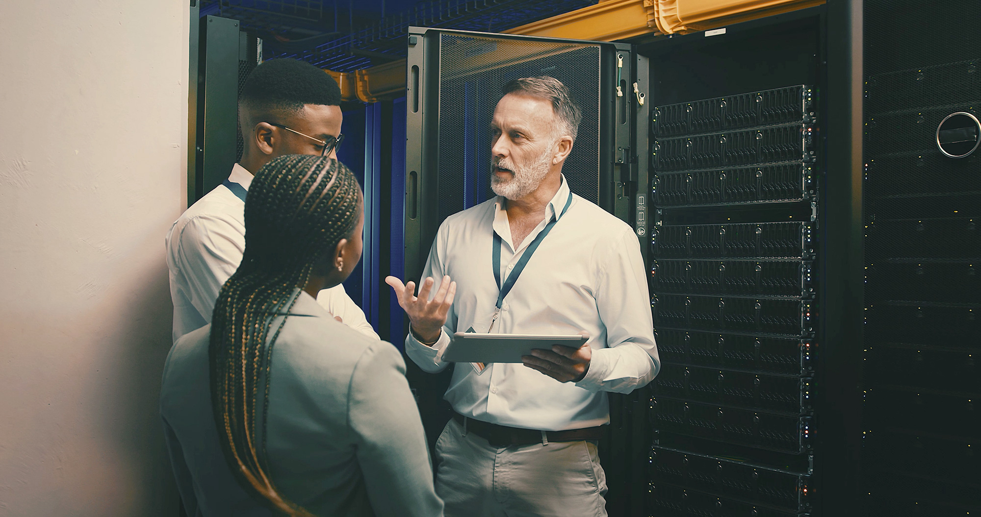 Cybersecurity professionals in a server room.