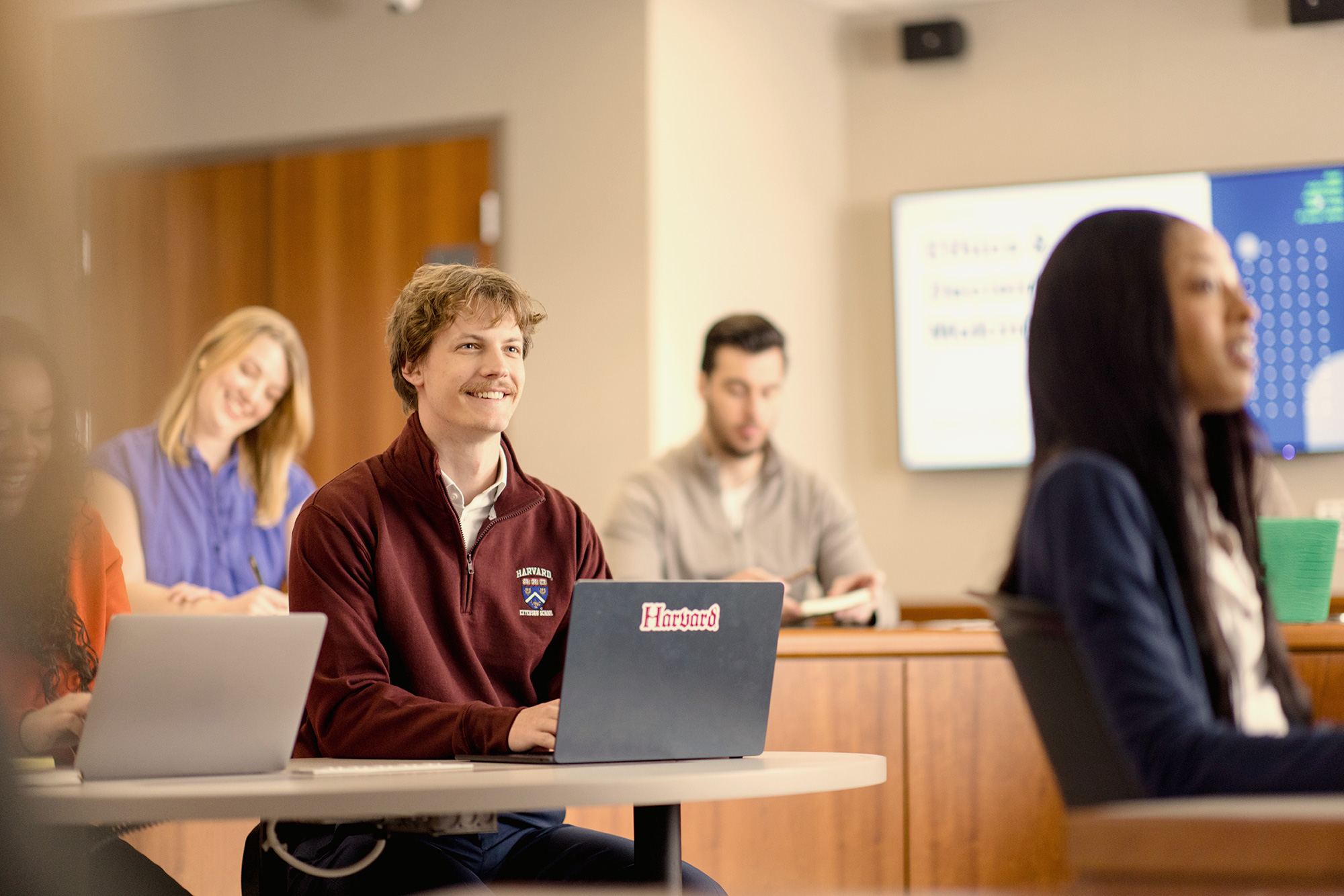 Harvard students in a classroom.