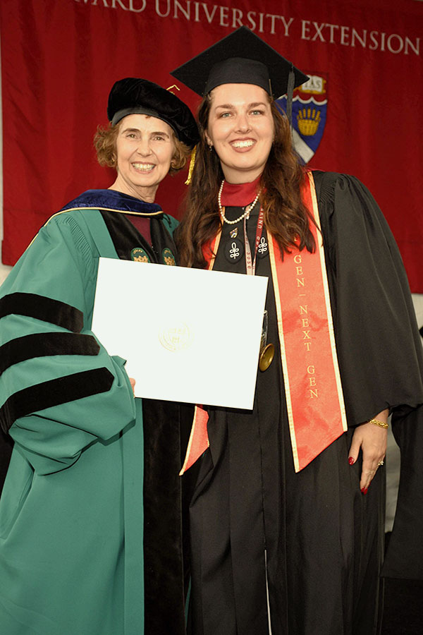 Taylor Izbicki at Commencement with Dean Spreadbury.